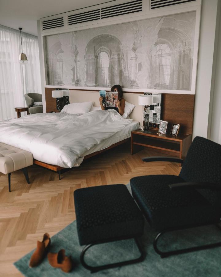 Andaz Vienna Am Belvedere, By Hyatt Exterior photo A woman using a Nespresso machine